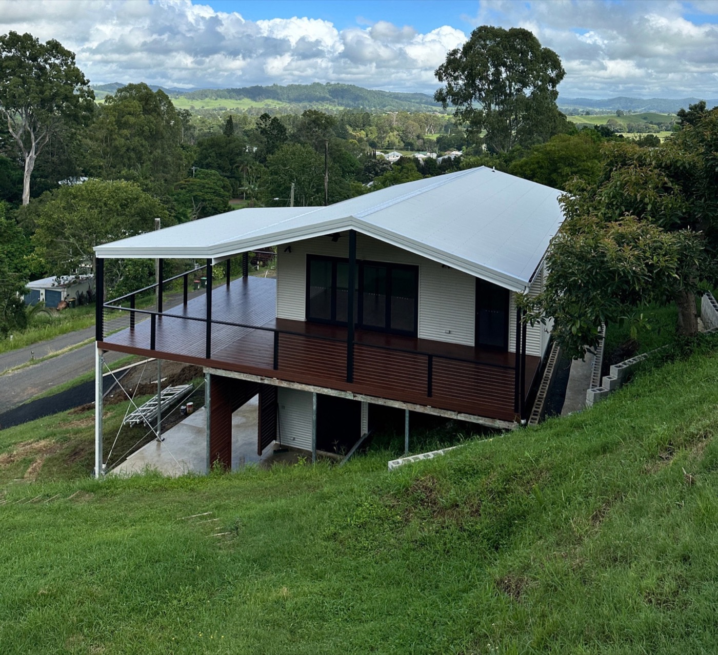 Elevated home with hardwood deck and rural outlook built by 3BC